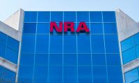 The letters NRA on the outside of the headquarters of the National Rifle Association