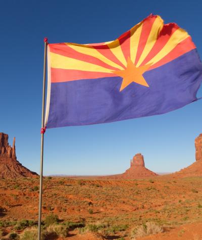 Arizona flag in desert.