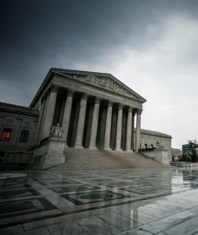 The front of the U.S. Supreme Court under cloudy skies